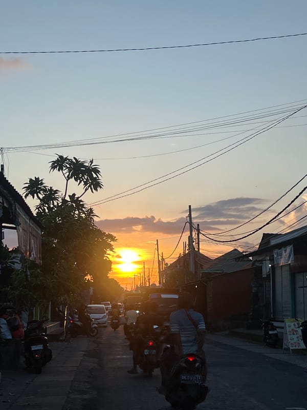 Golden twilight illuminates street scene in Saba, Indonesia