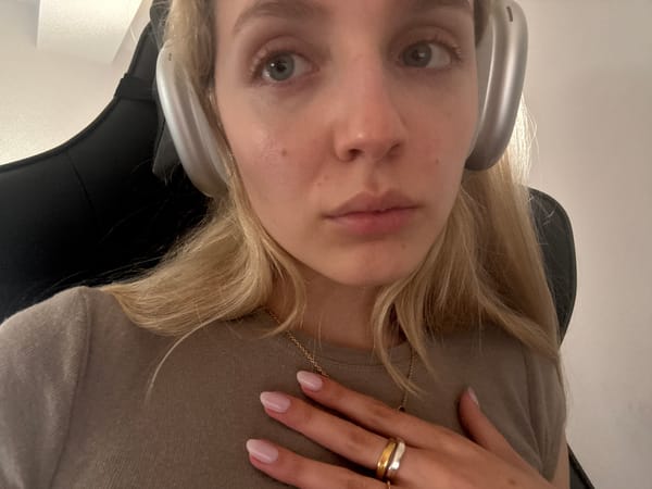 Woman with headphones, dog observed indoors in Mexico City