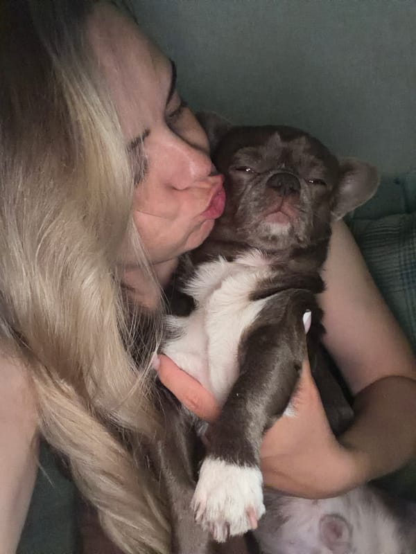 Woman photographed with puppy in multiple poses in Votkinsk