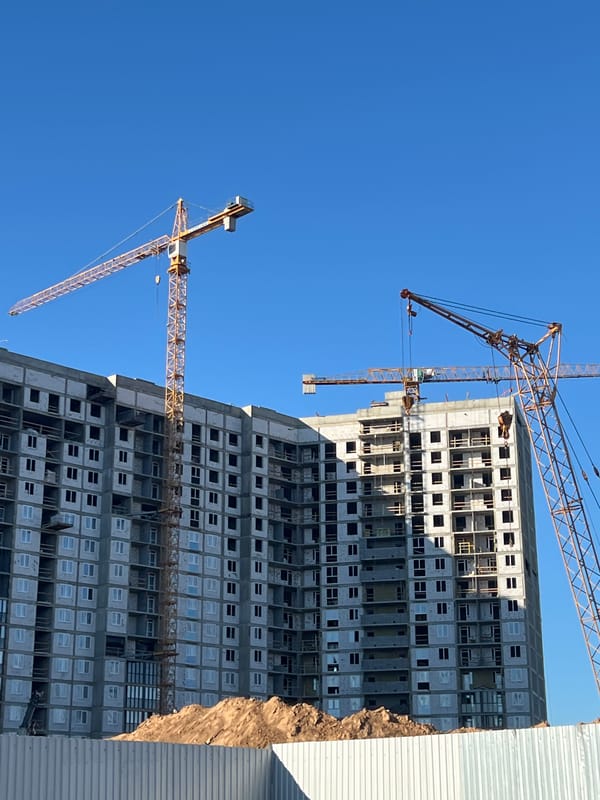Active construction zone and street-level commercial scene in Minsk