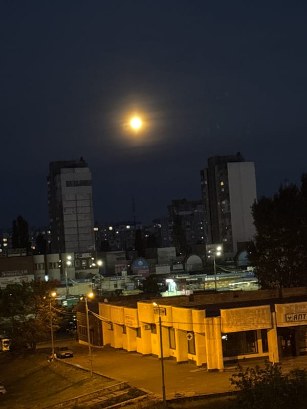 Kyiv night sky and drone-themed Ukrainian coin, summer 2026