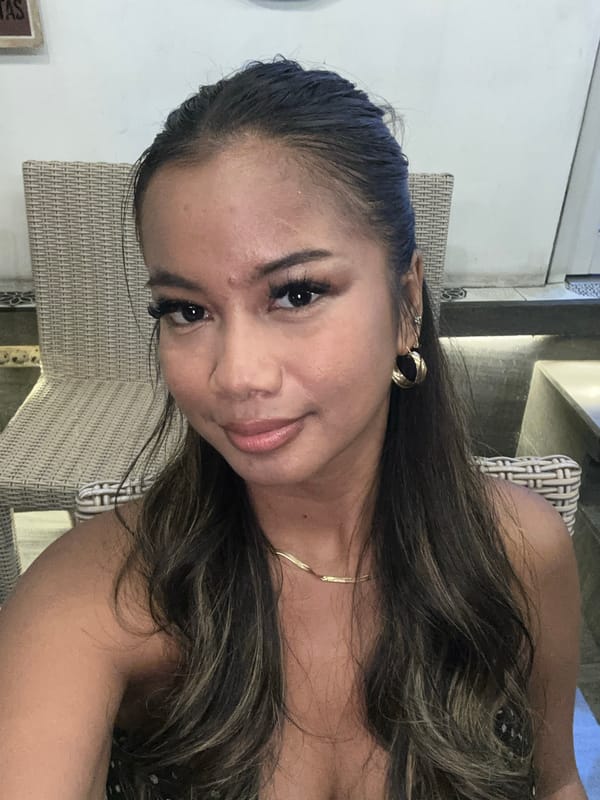 Woman photographed in indoor portrait session in Singapadu