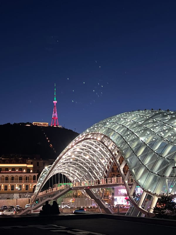 Nighttime cityscape documentation captures illuminated Tbilisi landmarks and architecture