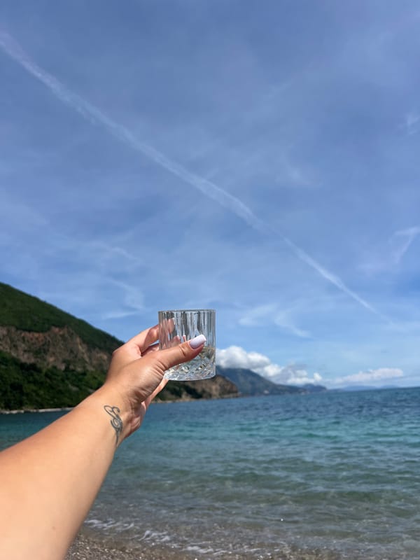 Woman enjoys waterfront leisure time in Prijevor, Montenegro