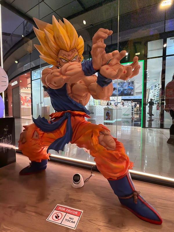 Barcelona plaza construction and anime statue witnessed during midday
