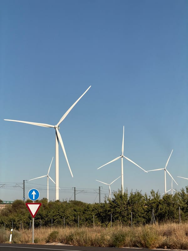 Highway scene near Motilla del Palancar with wind turbines in view