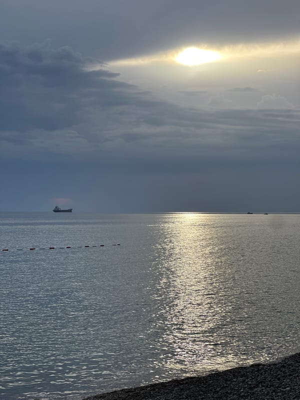 Sunlight breaks through clouds over Adriatic Sea at Šušanj
