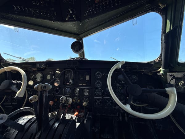Person observed in vintage aircraft cockpit during afternoon hours
