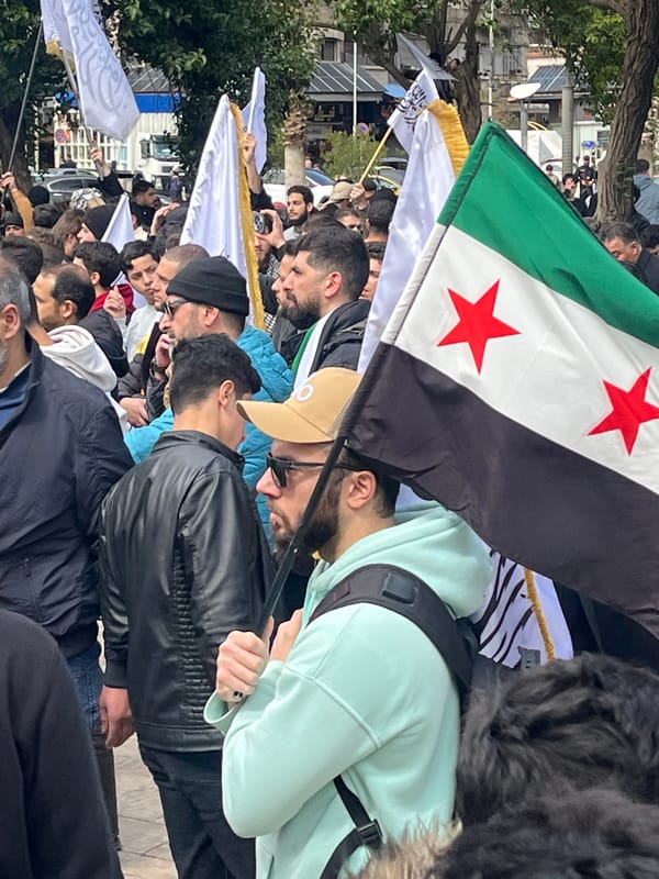 Large crowd demonstration with flags in Damascus, Syria