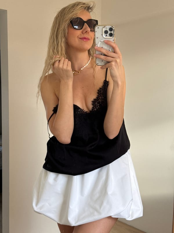 Woman photographed smiling in sunlight in Carnikava, Latvia