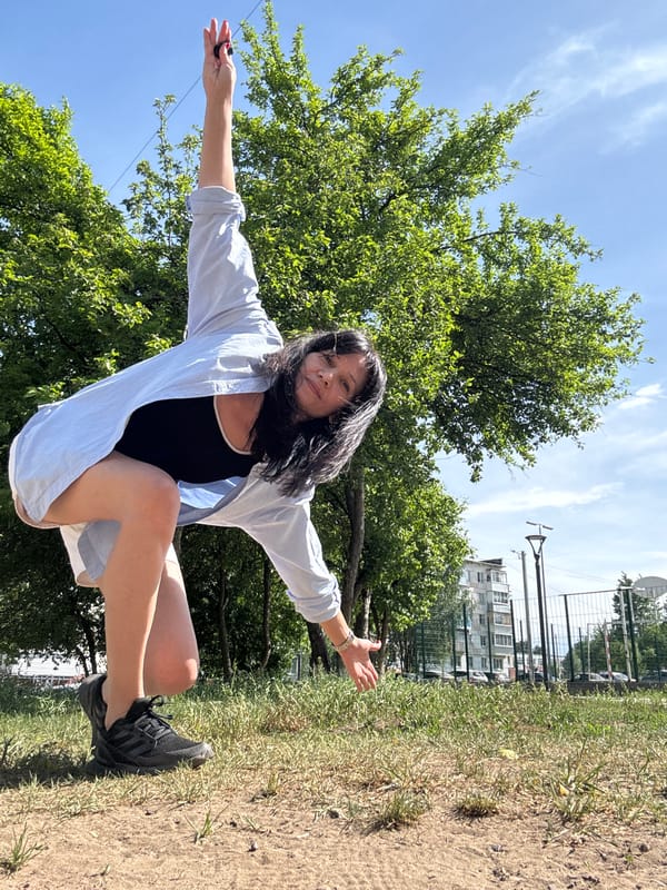 Woman poses for outdoor photo session in urban park