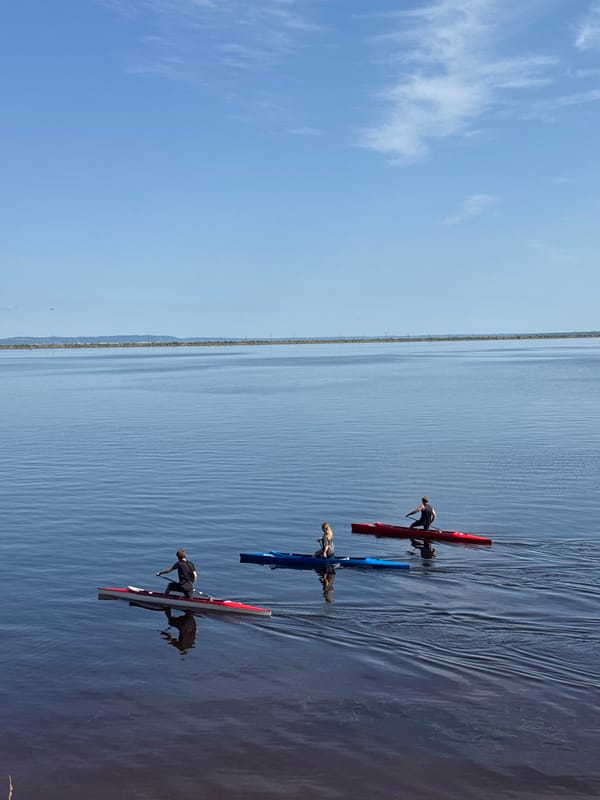 Kayaking and boating on a calm lake in Chaikovsky