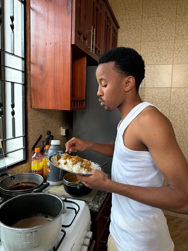 Plating rice and curry in a Dar es Salaam kitchen
