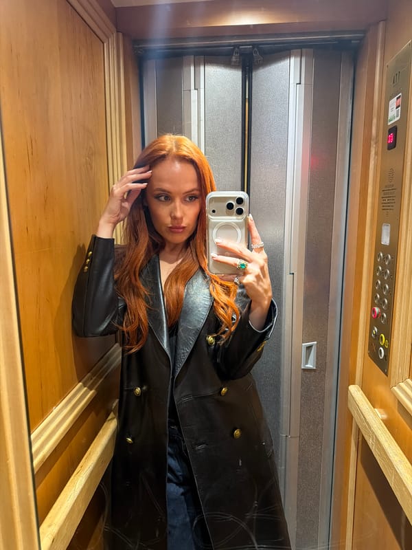 Woman takes elevator selfie in Paris