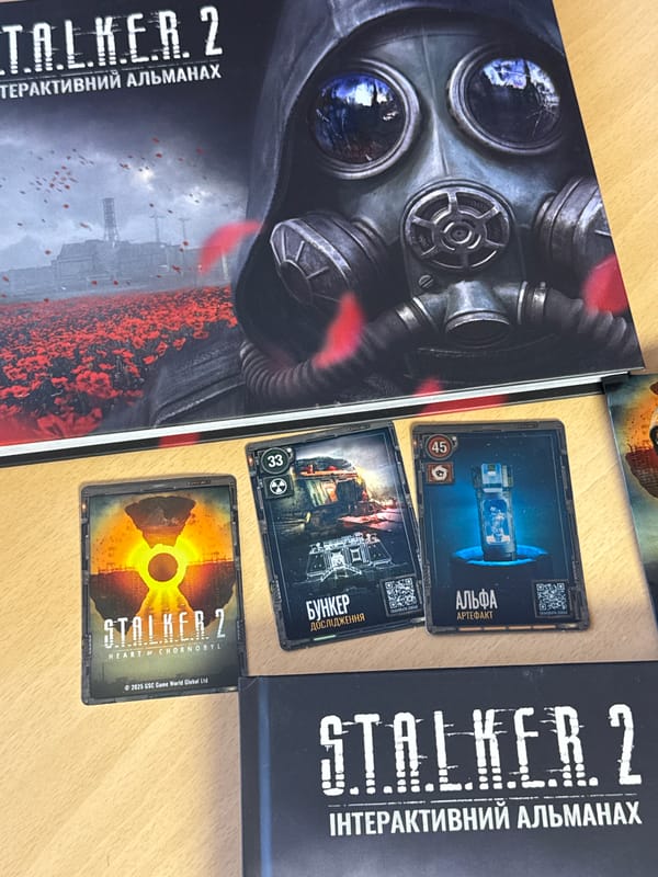 Kyiv resident unboxes STALKER 2 collector merchandise amid spring blooms