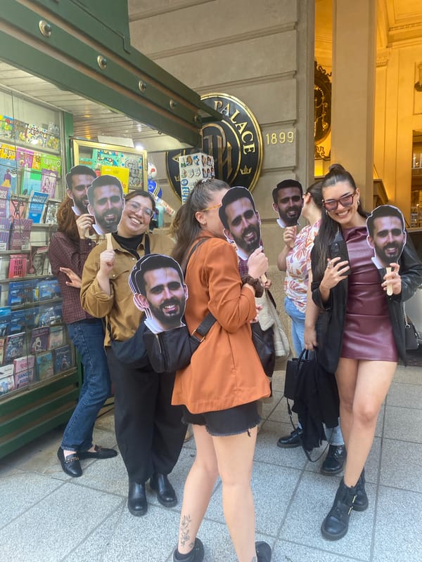 Group gathers with bearded man masks near Buenos Aires newsstand