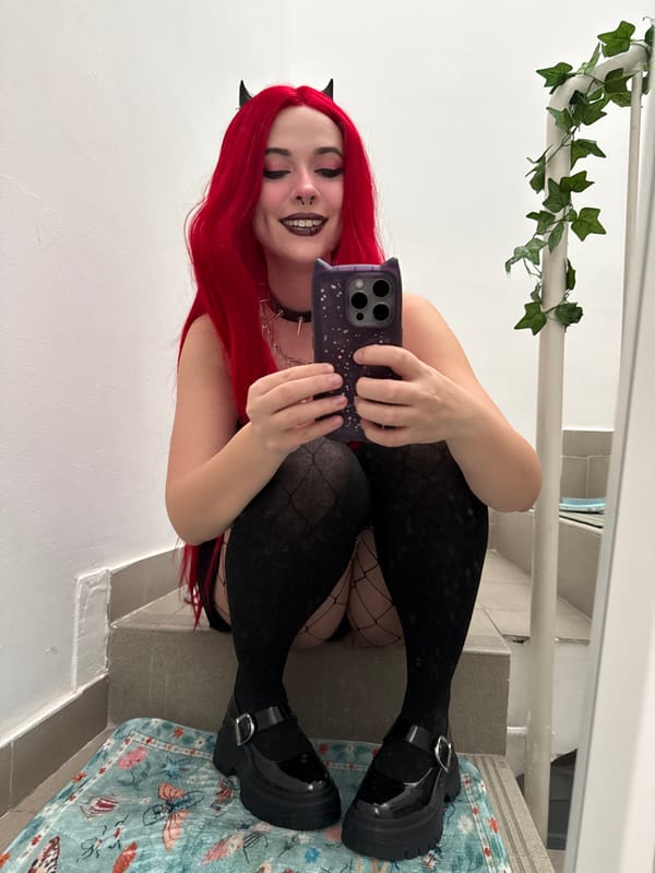 Gothic-styled person takes mirror selfies in Zagreb