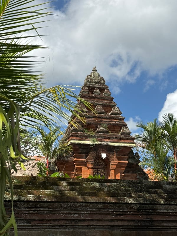 Ubud temple details and utility crew at work