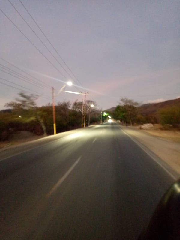 Nighttime street scene captured in San Juan Bautista, Venezuela