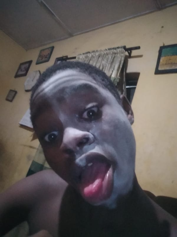 Person applies white facial mask in Shangisha home