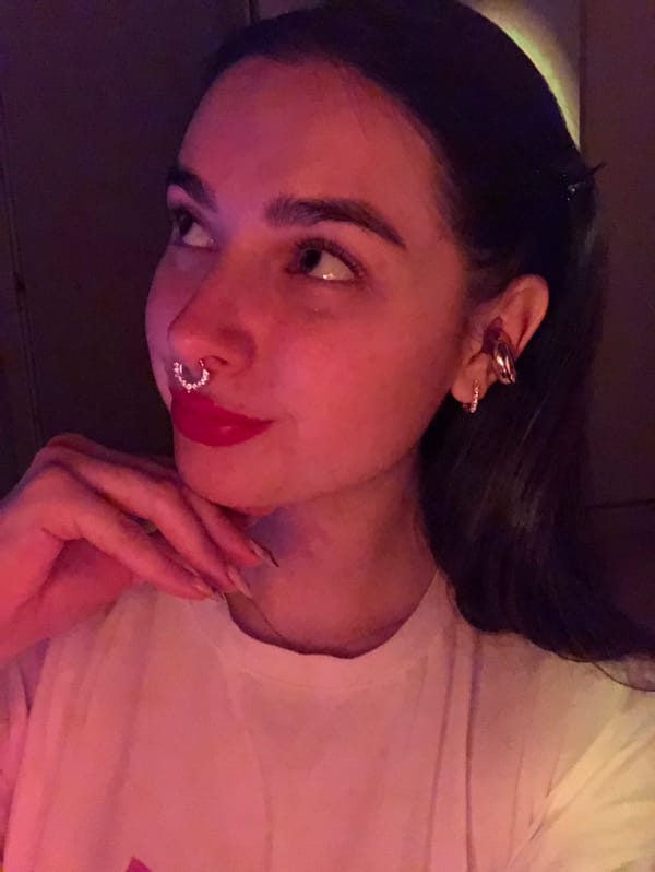Woman with piercings observed indoors in Noviy, Russia