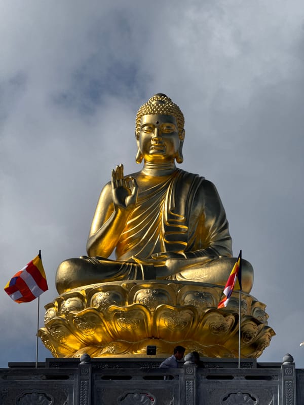 Tourists visit golden Buddha temple complex in Vietnam