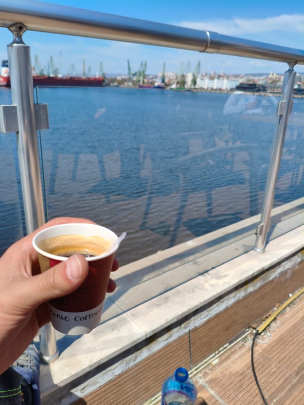 Morning coffee overlooking Varna harbor on sunny day