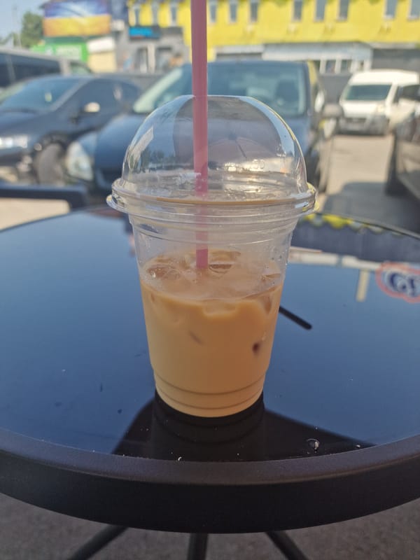 Iced coffee, a lounging cat, and morning cafe selfies