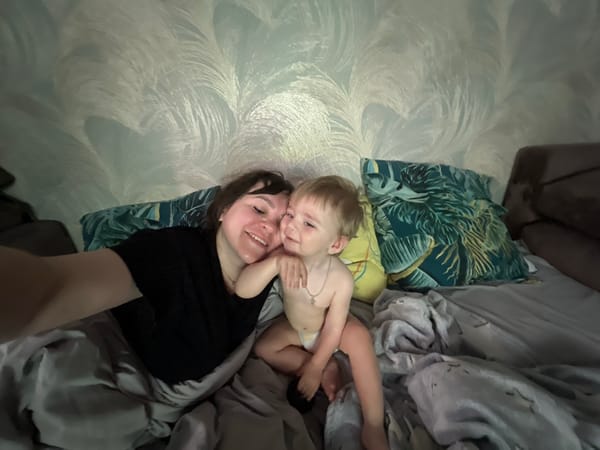 Mother and child rest in bed, Noviy Russia morning