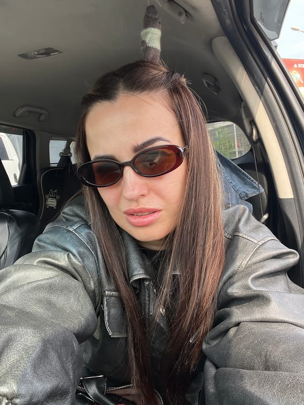 Woman in leather jacket spotted in car with skull candle