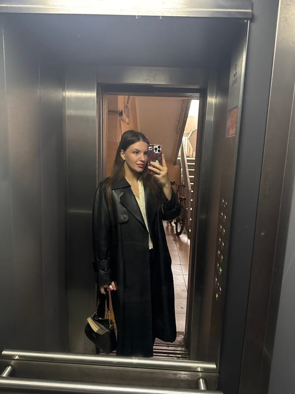 Woman takes early morning elevator selfie in Moscow