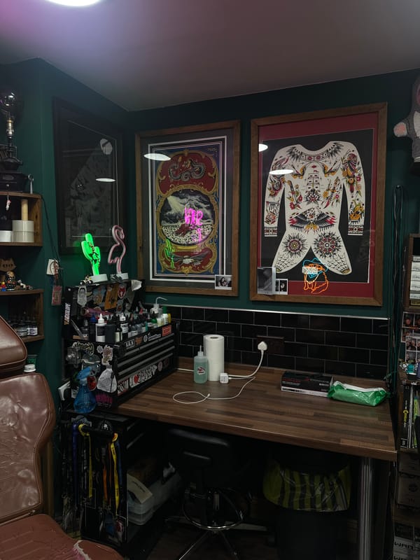 Tattoo artist workspace documented at Brighton convention