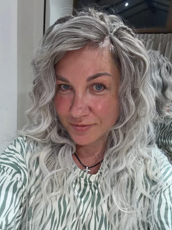 Portrait photograph of gray-haired woman captured by witness