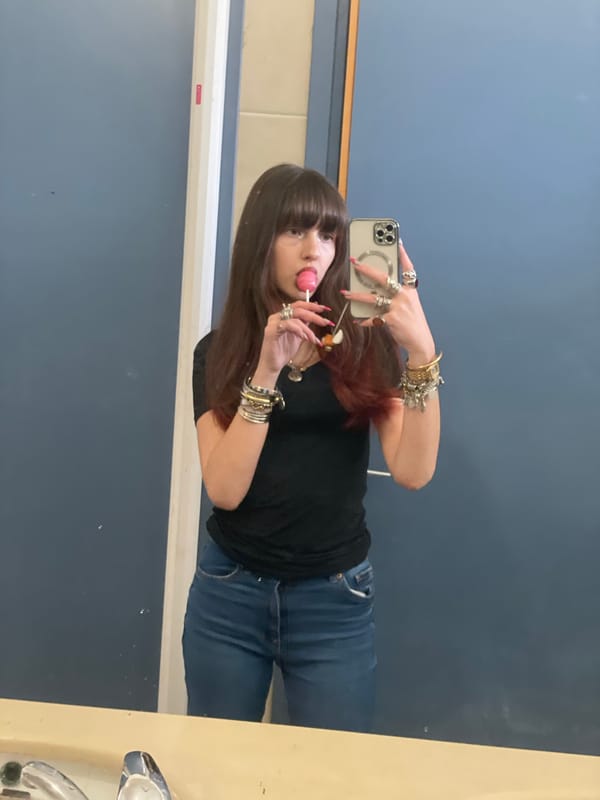 Woman takes bathroom selfie with lollipop in Raanana