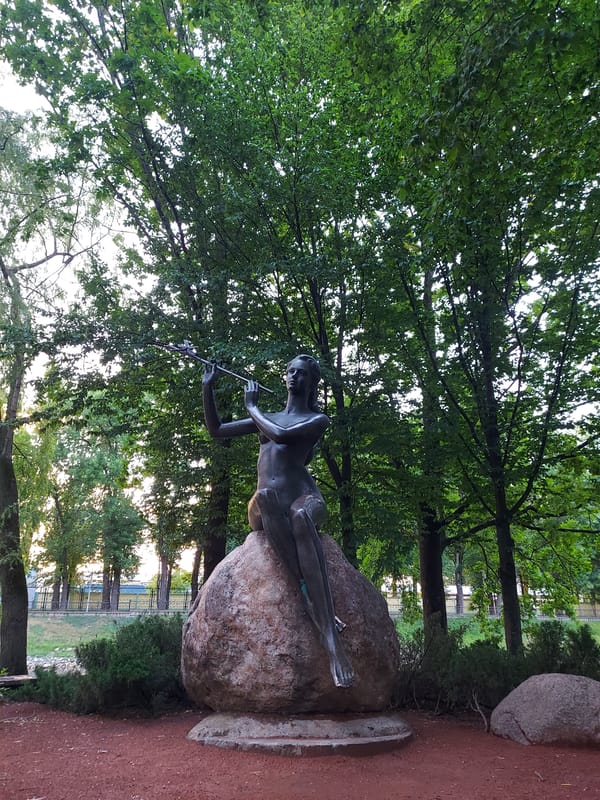 Summer evening in a Brest park — canals, ducks, cats, and dusk