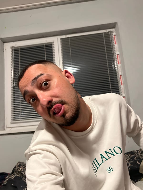 Man makes silly face in room in Shumata, Bulgaria