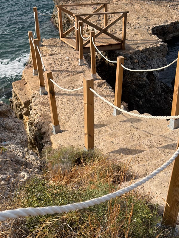 Rugged coastal stairway leads to the sea in Calvià, Mallorca