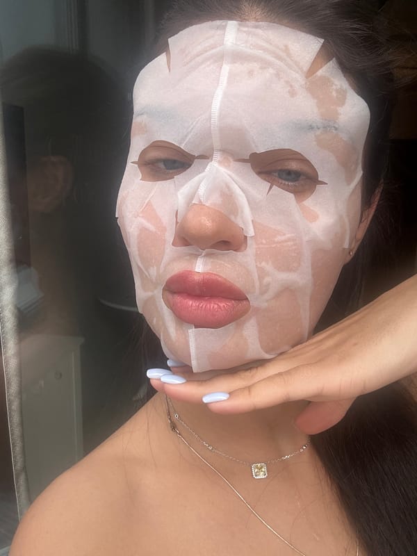 Facial treatment with white sheet mask observed in Angelovo