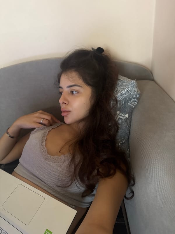 Lazy afternoon on a gray sofa in Plovdiv, laptop in hand.