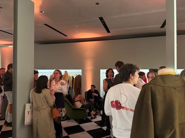Social gathering at upscale Milan boutique or gallery space