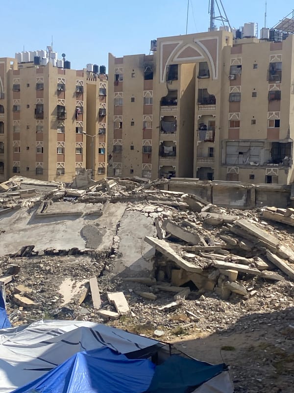 Person enjoys hot beverage in Khan Yunis