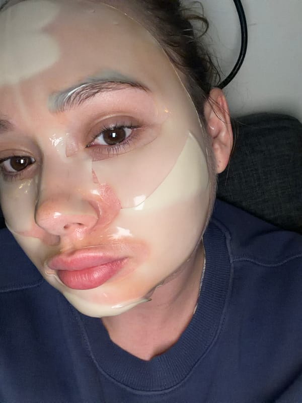 Person wearing facial sheet mask photographed in Ramat Gan