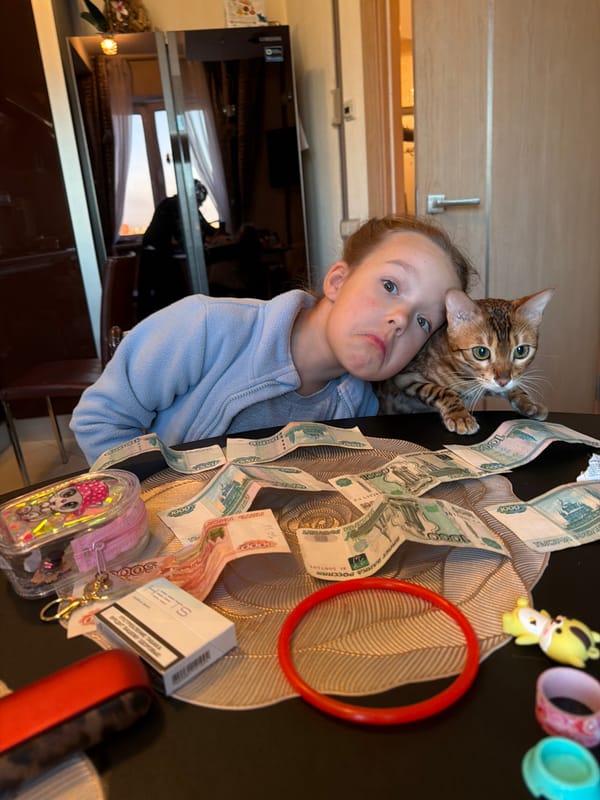 Girl with cat in Saint Petersburg home
