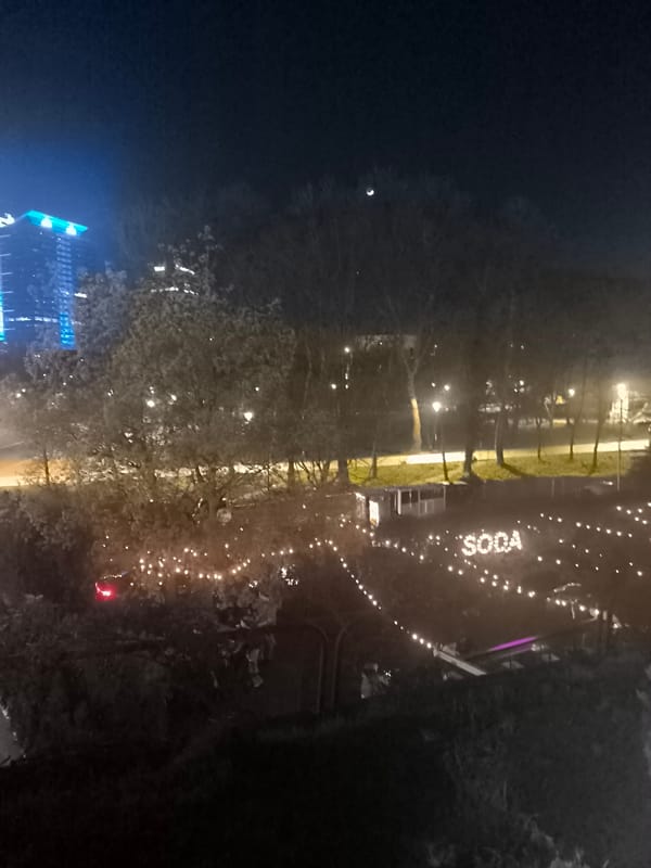 Sofia nighttime scene captured with tourism display, classic car