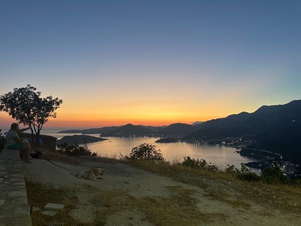 Golden hour over Sveti Stefan's bay from a stone wall