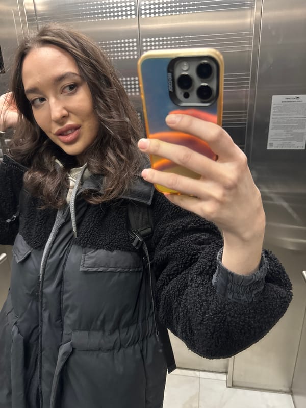 Woman takes selfies in elevator in Khimki, Russia