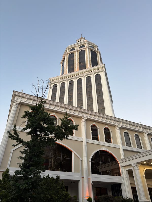 Batumi architecture and aged street sculpture, July 2026