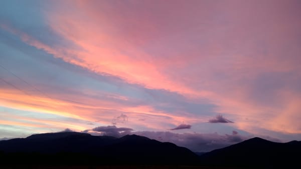 Colorful sunset observed over mountain range in Bulgarian village