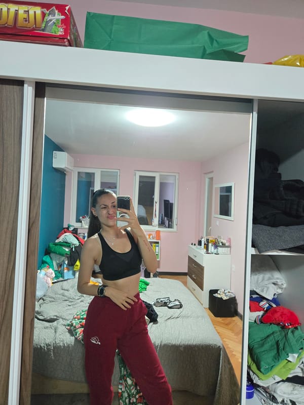 Woman documents bedroom selfie session in Pleven, Bulgaria