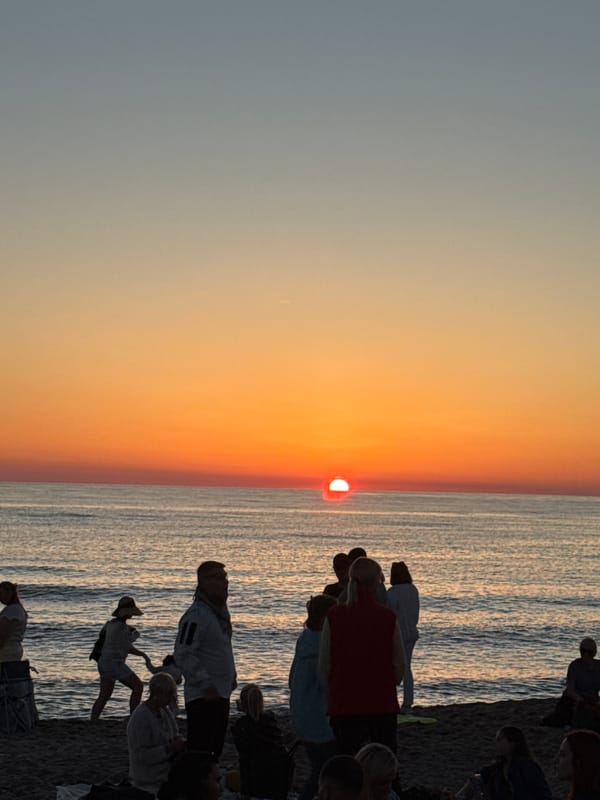 Crowded beach day turns into a yellow-themed outdoor event